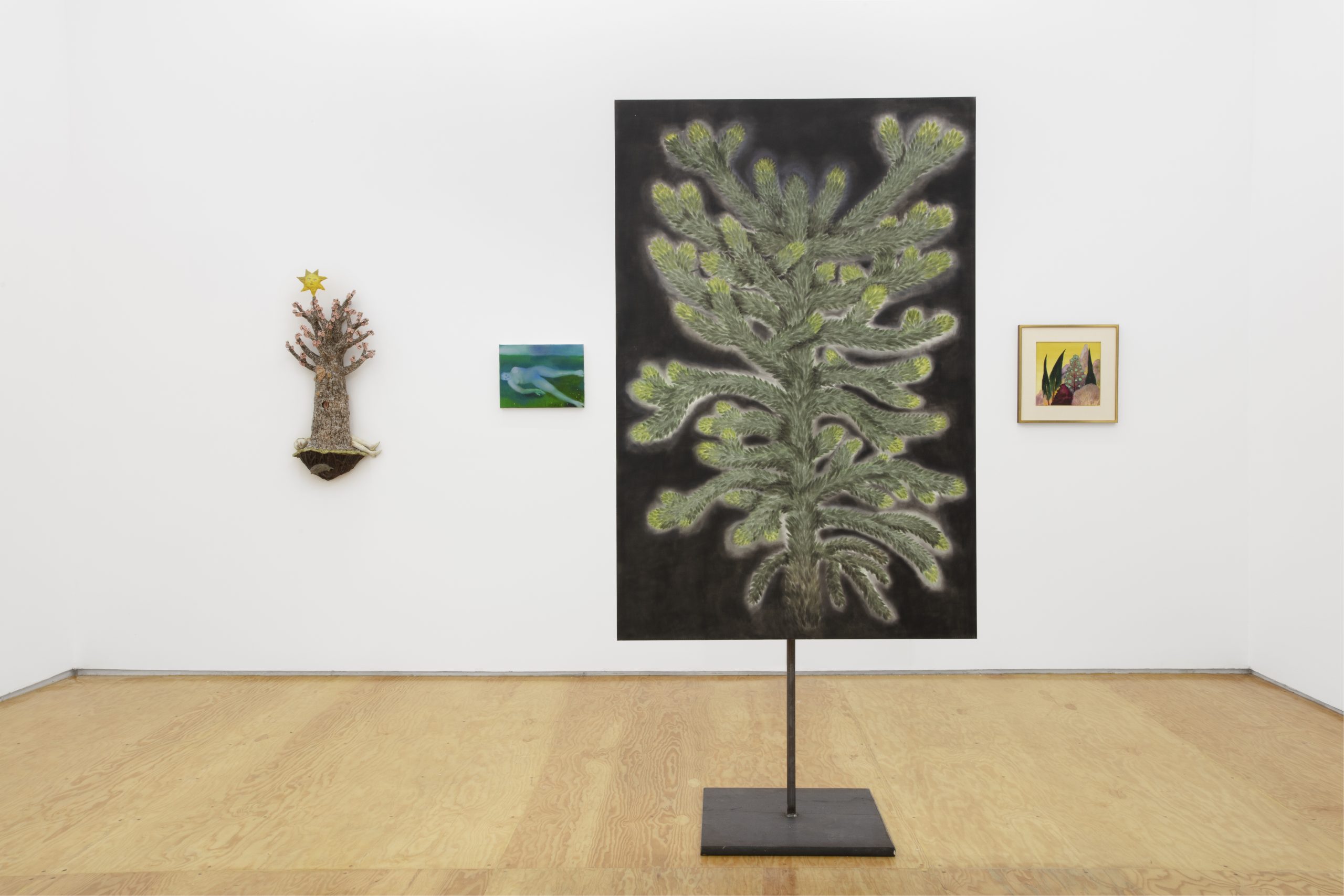 installation view with three paintings and one sculpture