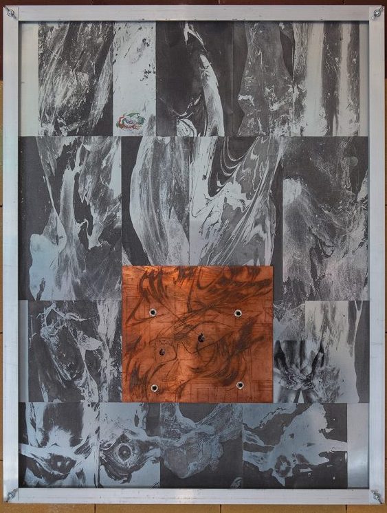 Abstract gray collage work with orange center