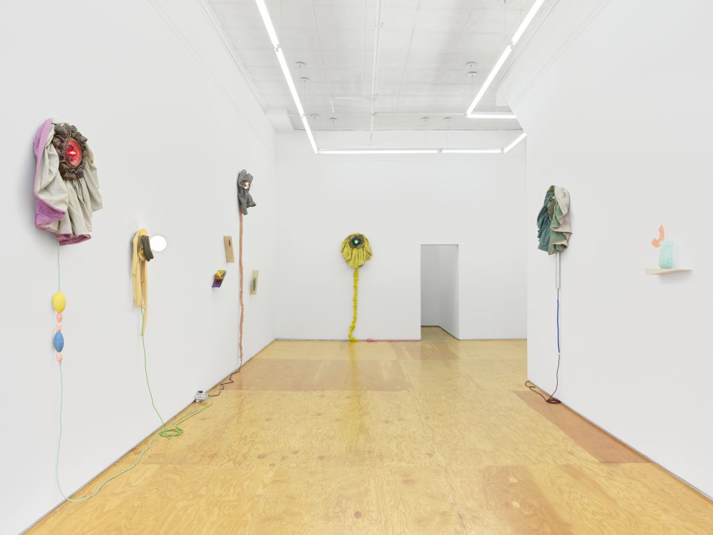 Installation view, Laura Aldridge at Margot Samel. Lamps and sculptures playful colors and range of materials, fabric, glass, wood, ceramic, stone.