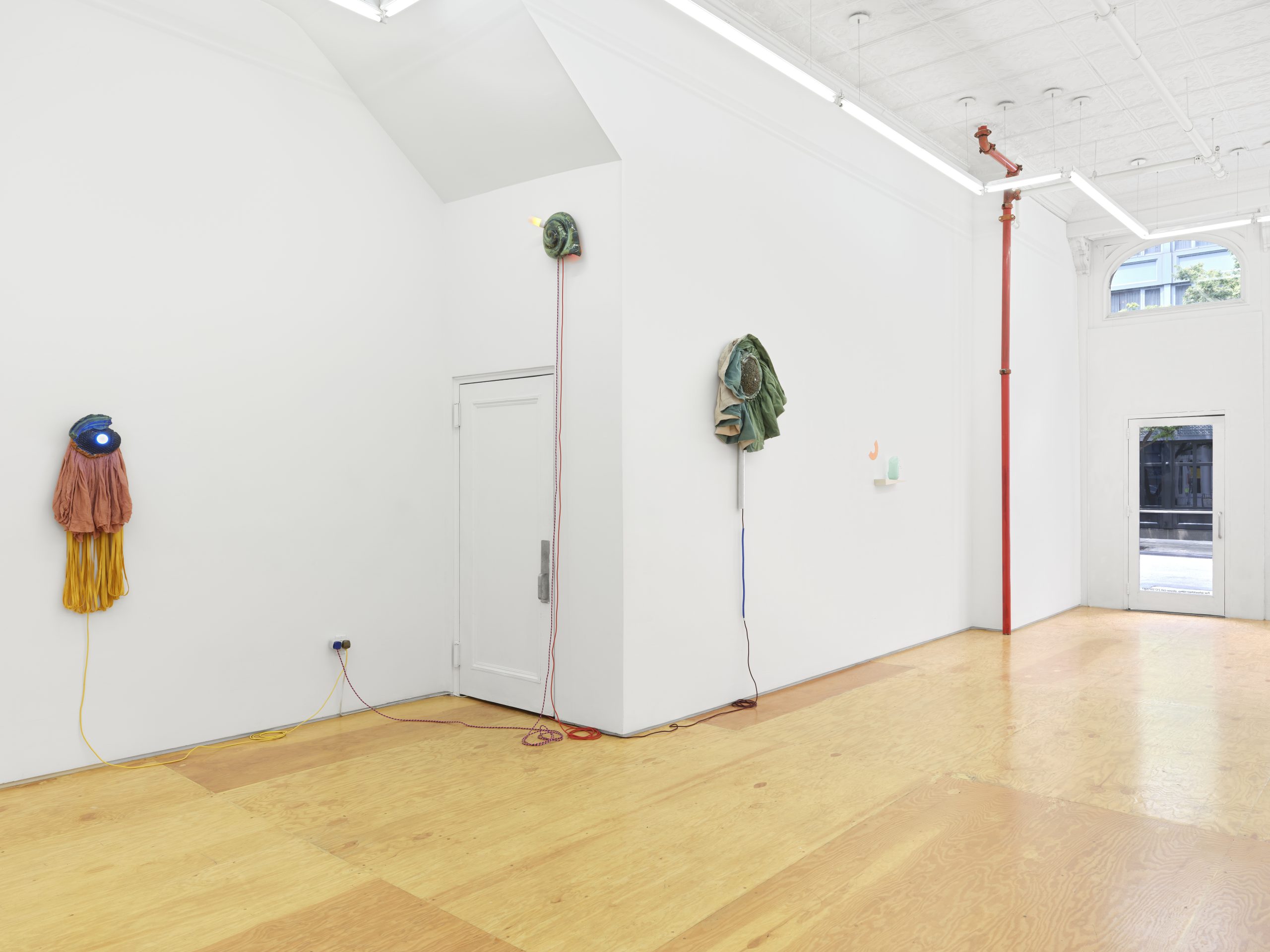 Installation view, Laura Aldridge at Margot Samel. Lamps and sculptures playful colors and range of materials, fabric, glass, wood, ceramic, stone.