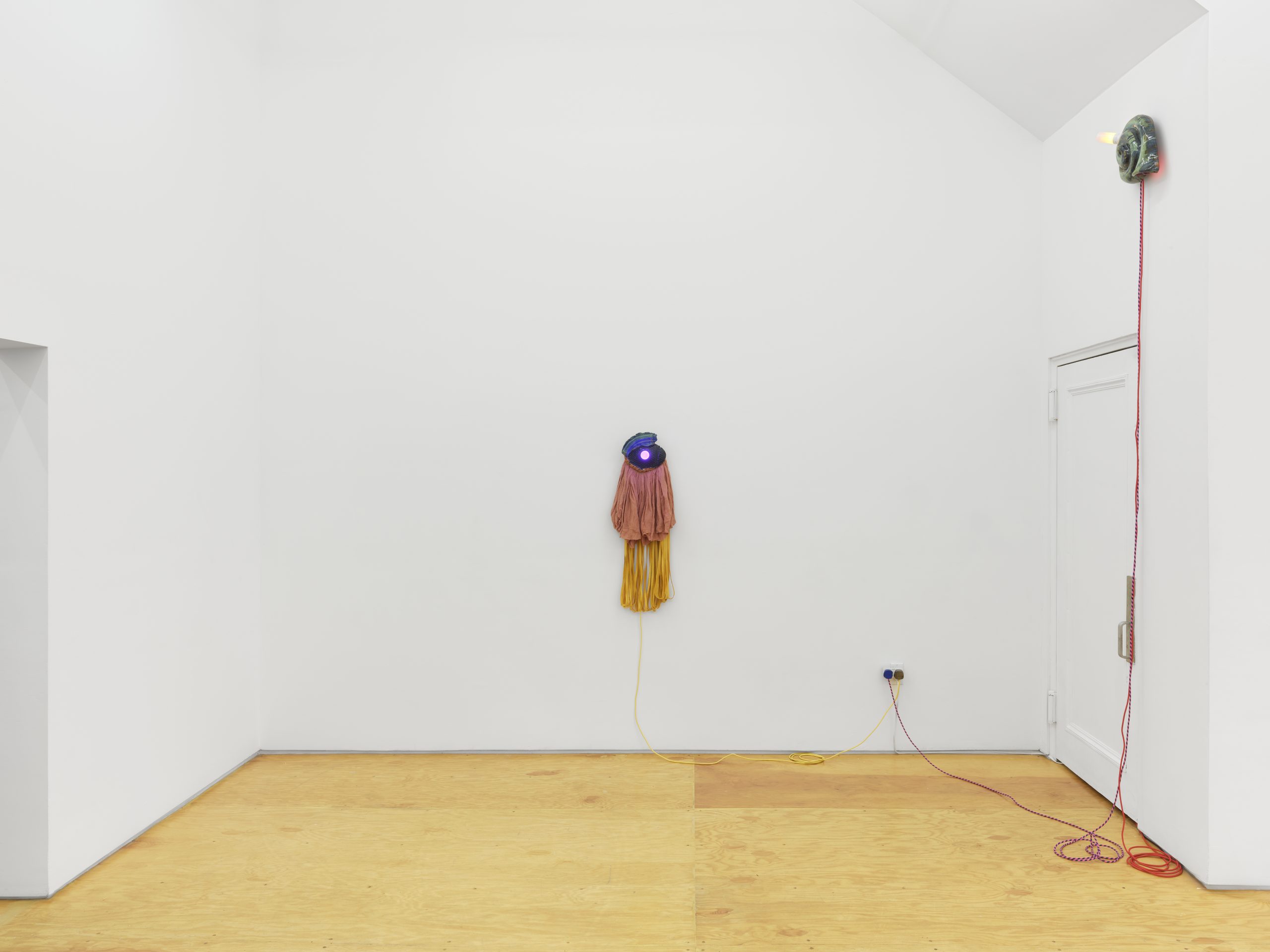 Installation view, Laura Aldridge at Margot Samel. Lamps and sculptures playful colors and range of materials, fabric, glass, wood, ceramic, stone.