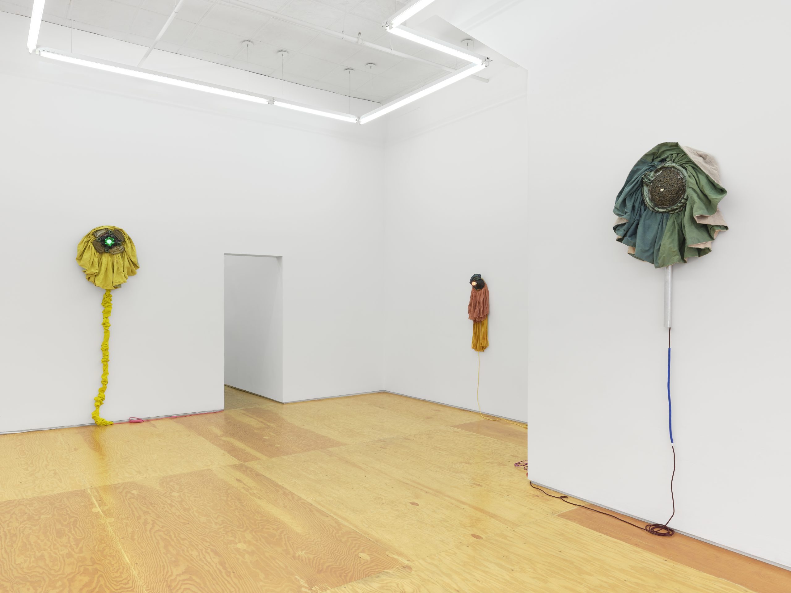 Installation view, Laura Aldridge at Margot Samel. Lamps and sculptures playful colors and range of materials, fabric, glass, wood, ceramic, stone.