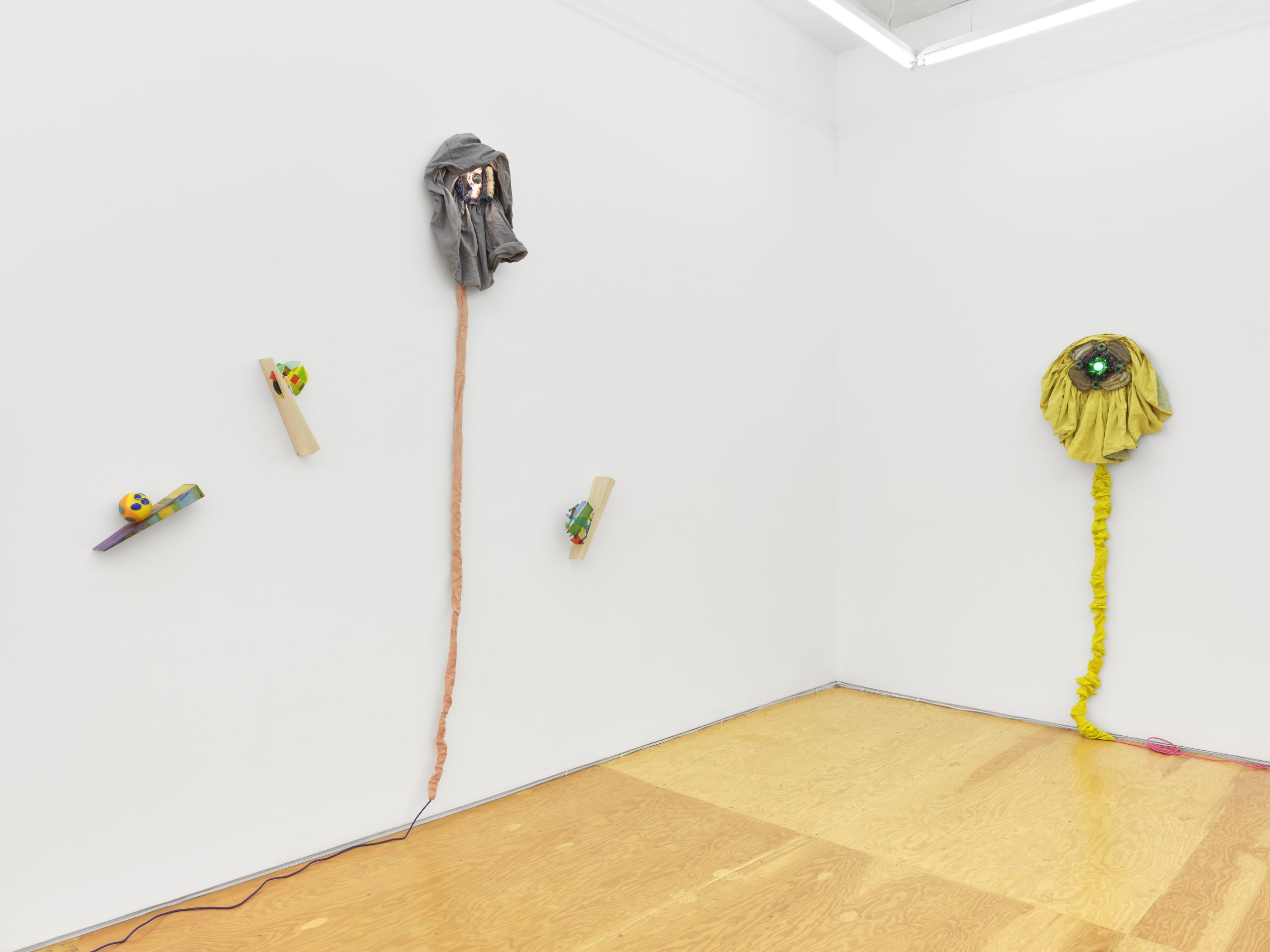 Installation view, Laura Aldridge at Margot Samel. Lamps and sculptures playful colors and range of materials, fabric, glass, wood, ceramic, stone.