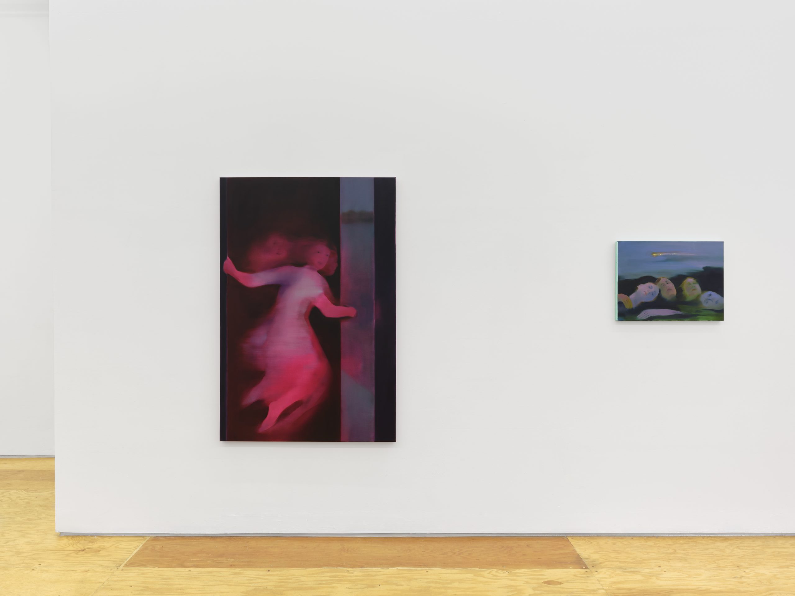 White gallery wall with two paintings: a tall magenta figure painting on the left and a small horizontal landscape-like painting on the right.