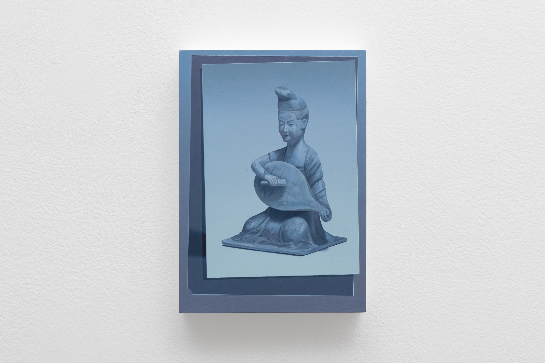 stone like figure with an instrument